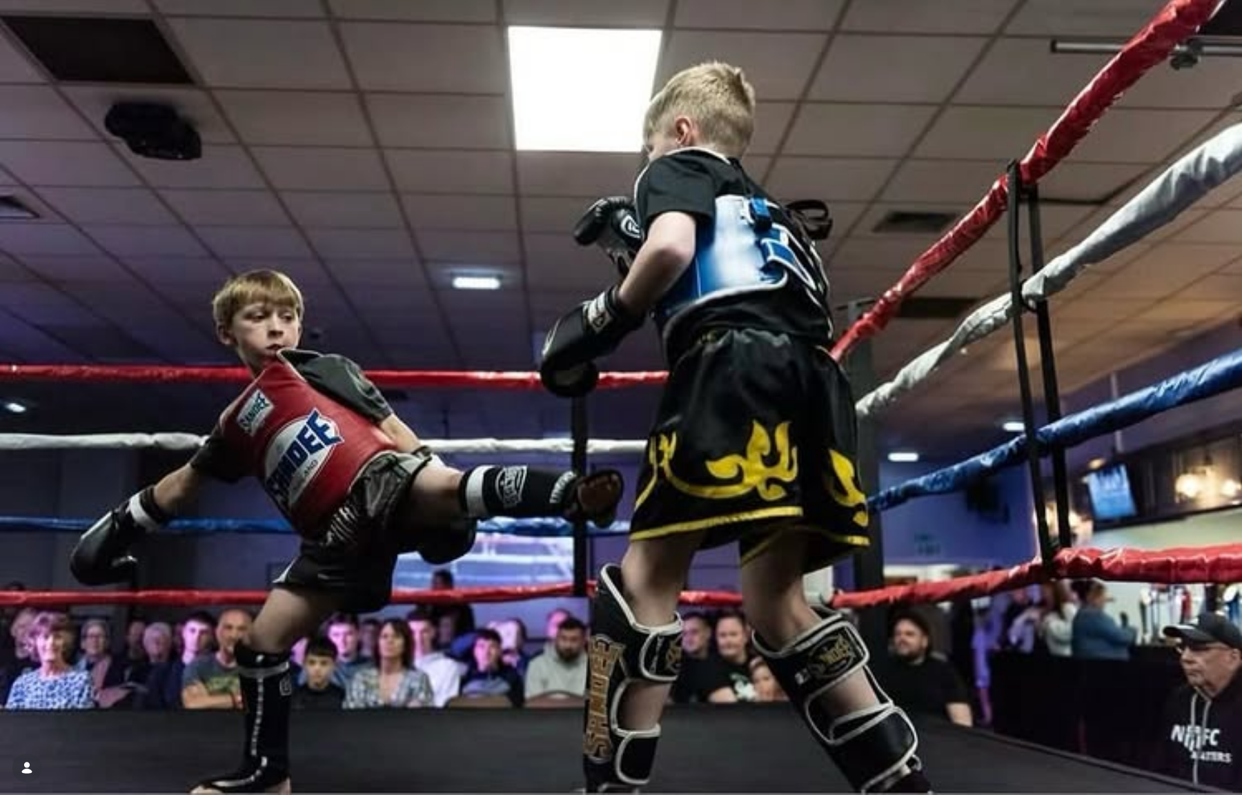 Young AIKI fighters sparring in the ring